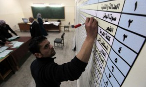 An election official tallies votes in Amman, Jordan
