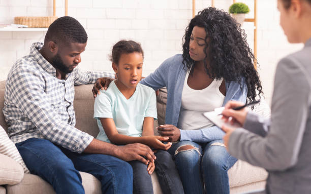 teen getting support from his family and doctor