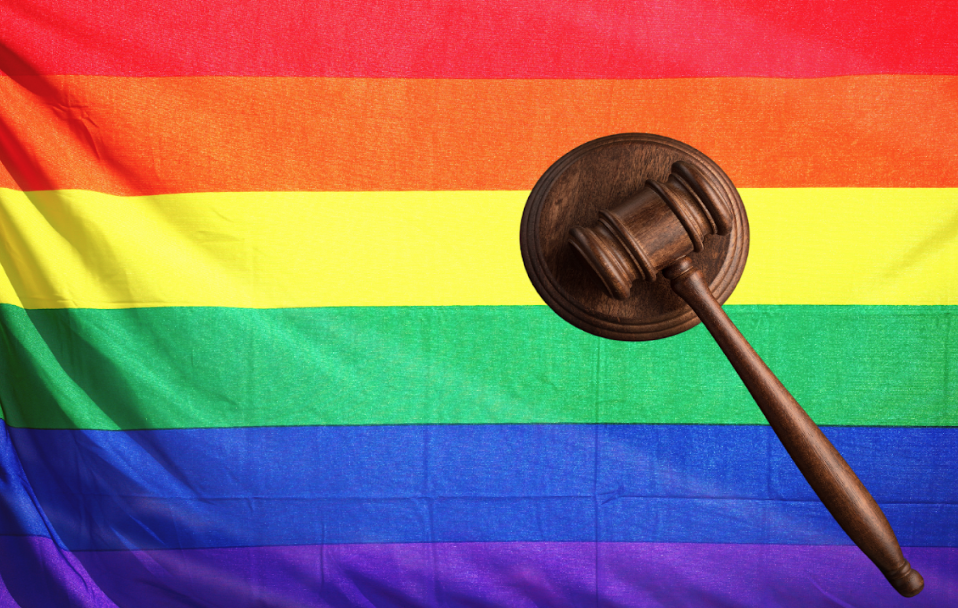 LGBTQ rainbow flag with wooden judge mallet